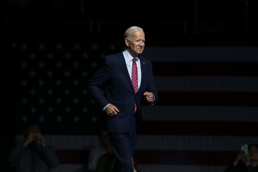 FILE - In this Friday, Nov. 1, 2019, file photo, Democratic presidential candidate former Vice President Joe Biden walks on stage to speak at the Iowa Democratic Party's Liberty and Justice Celebration, in Des Moines, Iowa. Biden is working on a national campaign of his own, but he made time for a trip to Virginia, Sunday, Nov. 3, to rally party activists two days before a pivotal state election. (AP Photo/Nati Harnik, File)