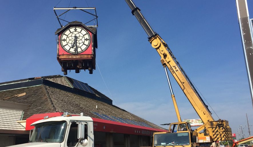In this Tuesday, Oct. 29, 2019 photo, The Hour Time clock, a Lafayette, Ind. landmark since 1979, was removed from the top of the restaurant at Interstate 65 and South Street. Three years after it was plucked from its perch near an Interstate 65 exit, the clock that was a Lafayette icon on top of the Hour Time Restaurant for four decades has a new owner and could have a new home soon.(Dave Bangert/Journal & Courier via AP)