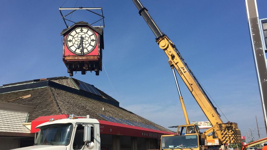 In this Tuesday, Oct. 29, 2019 photo, The Hour Time clock, a Lafayette, Ind. landmark since 1979, was removed from the top of the restaurant at Interstate 65 and South Street. Three years after it was plucked from its perch near an Interstate 65 exit, the clock that was a Lafayette icon on top of the Hour Time Restaurant for four decades has a new owner and could have a new home soon.(Dave Bangert/Journal & Courier via AP)