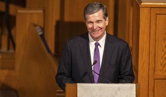 Gov. Roy Cooper speaks during the memorial service for former U.S. Sen. Kay Hagan at First Presbyterian Church, Sunday, Nov. 3, 2019, in Greensboro, N.C. Hagan died Monday, Oct. 28 of a rare virus, at the age of 66. (Khadejeh Nikouyeh/News &amp;amp; Record via AP)