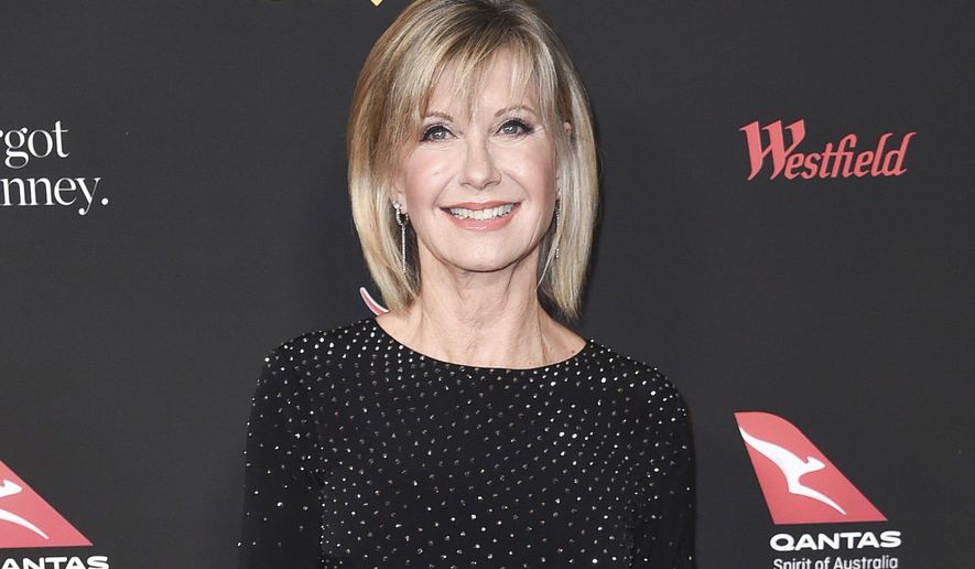 In this Jan. 27, 2018 file photo, Olivia Newton-John attends the 2018 G&#39;Day USA Los Angeles Gala at the InterContinental Hotel Los Angeles. (Photo by Richard Shotwell/Invision/AP, File)