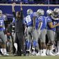 Memphis coach Mike Norvell celebrates along with players on the sideline late in the fourth quarter of the team&#39;s NCAA college football game against SMU on Saturday, Nov. 2, 2019, in Memphis, Tenn. Memphis won 54-48. (AP Photo/Mark Humphrey)