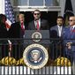 Washington Nationals starting pitcher Max Scherzer, center, speaks as first lady Melania Trump, from left, President Donald Trump, manager Dave Martinez and general manager Mike Rizzo listen, during an event to honor the 2019 World Series champion Nationals baseball team at the White House, Monday, Nov. 4, 2019, in Washington. (AP Photo/Patrick Semansky)