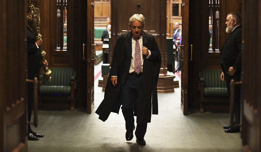 In this photo released by the U.K. Parliament, Speaker of the House of Commons John Bercow gestures during his final day in the Chair in the House of Commons, in London, Thursday, Oct. 31, 2019. The speaker of Britain's House of Commons, who has become a global celebrity and online meme-magnet for his loud ties, even louder voice and star turn at the center of Britain's Brexit drama, stepped down on Thursday after 10 years in the job. (UK Parliament/Jessica Taylor via AP)