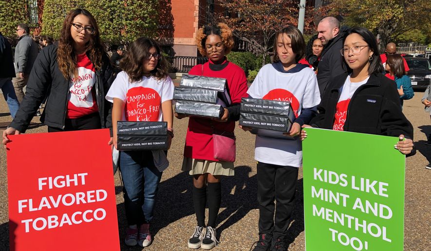 Youth advocates for the Campaign for Tobacco-Free Kids tried to deliver a petition to the White House on Nov. 4 asking President Trump to stay strong on his commitment to remove all e-cigarette flavors, including mint and menthol. (Shen Wu Tan/The Washington Times)