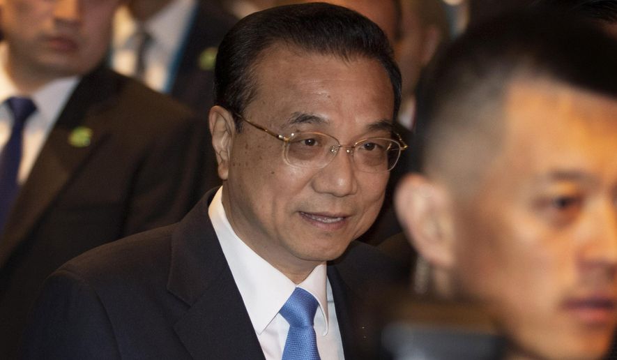 FILE - In this Nov. 3, 2019, file photo, Chinese Premier Li Keqiang arrives to participate in ASEAN-China summit in Nonthaburi, Thailand. Li is renewing a call for progress toward a code of conduct among South China Sea disputants, despite long delays and skepticism from the United States. (AP Photo/Gemunu Amarasinghe, File)