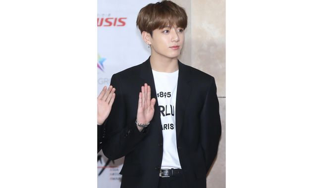 In this Nov. 28, 2018, photo, a member of K-pop group BTS, Jungkook, poses for the media at the Asia Artist Awards in Incheon, South Korea. Police say they are investigating Jungkook over a traffic accident on Saturday, Nov. 2, 2019, involving the band member and a taxi driver. (Cho Su-jeung/Newsis via AP)