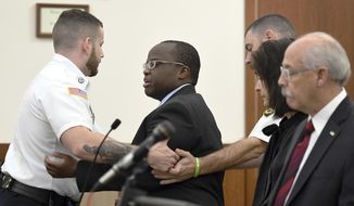 Defendant David Njuguna is removed from Worcester Superior Court in Worcester, Massachusetts after a rambling outburst before closing arguments were set to begin in his trial Tuesday, October 29, 2019. Njuguna is charged in a 2016 crash on the Massachusetts Turnpike in Charlton that claimed the life of Mass. State Trooper Thomas L. Clardy.(Rick Cinclair/Worcester Telegram &amp;amp; Gazette via AP)