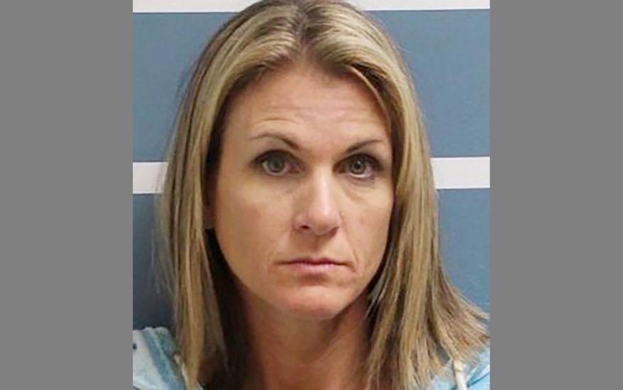 File - This October 2019 file booking photo provided by the Visalia Police Department shows Coral Lytle. Lytle, convicted of having sex with two teenage boys, has been sentenced to four years in prison. She was sentenced Monday, Nov. 4, 2019 and taken into custody. (Visalia Police Department via AP, File)