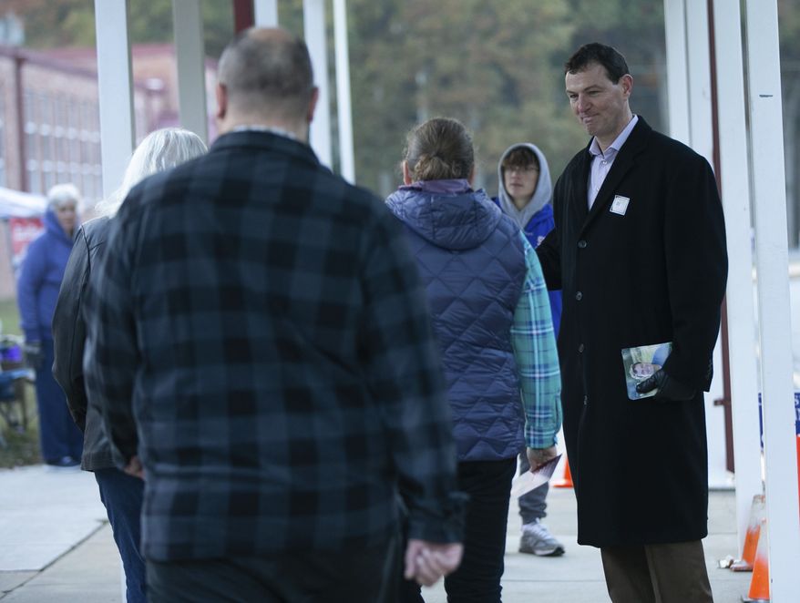 Paul Milde, the Republican candidate for the House of Delegates 28th District, greets at Ferry Farm Elementary School on Election Day in Stafford, Va., Tuesday, Nov. 5, 2019. (Mike Morones/The Free Lance-Star via AP)