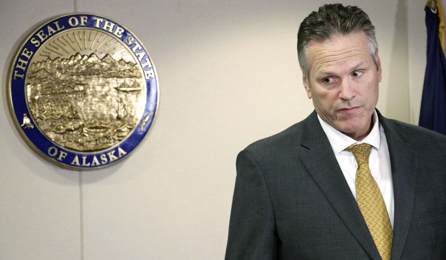 FILE - In this Sept. 26, 2019 file photo, Alaska Gov. Mike Dunleavy announces at a news conference in Anchorage, Alaska, that he has signed an administrative order directing state officials to create a program where state employees can opt in or out from having union fees and dues deducted from their checks. A group seeking to recall Alaska Gov. Mike Dunleavy is asking a judge to allow their effort to move forward. Attorneys for the Recall Dunleavy campaign, in court papers filed Tuesday, Nov. 5, 2019 say Division of Elections Director Gail Fenumiai wrongly refused to certify the recall application. (AP Photo/Mark Thiessen, File)