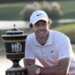 Rory McIlroy of Northern Ireland poses with the trophy after winning the HSBC Champions golf tournament at the Sheshan International Golf Club in Shanghai on Sunday, Nov. 3, 2019. (AP Photo/Ng Han Guan)