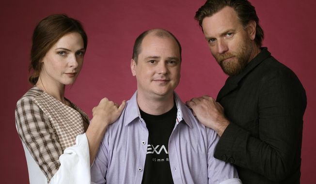 This Oct. 28, 2019 photo shows writer-director Mike Flanagan, center, and actors Rebecca Ferguson, left, and Ewan McGregor posing for a portrait to promote the film, &amp;quot;Doctor Sleep,&amp;quot; at The London West Hollywood hotel in West Hollywood, Calif. (Photo by Chris Pizzello/Invision/AP)