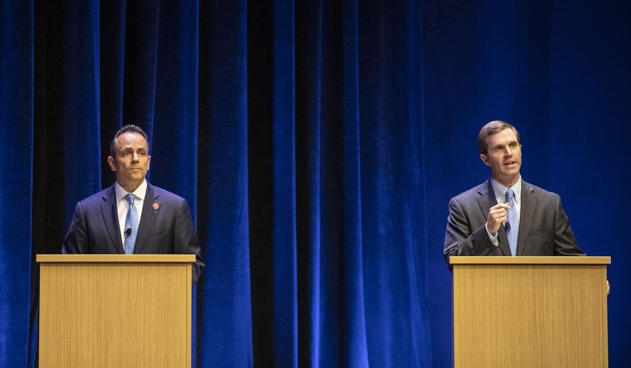 FILE - In this Tuesday, Oct. 15, 2019 file photo, Republican Gov. Matt Bevin, left, and Democratic Attorney General Andy Beshear participate in a debate, in Lexington, Ky. Kentucky&#39;s political grudge match between Republican Gov. Matt Bevin and Democratic Attorney General Andy Beshear now lies in the hands of the voters. (Ryan C. Hermens/Lexington Herald-Leader via AP, Pool)