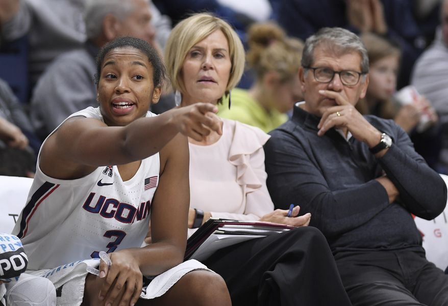 Connecticut&#39;s Megan Walker, left, gestures to her team as associate head coach Chris Dailey, center, and head coach Geno Auriemma, right, look on during the second half of an NCAA college exhibition basketball game against Jefferson, Sunday, Nov. 3, 2019, in Storrs, Conn. (AP Photo/Jessica Hill)