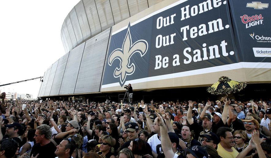 FILE - In this Sept. 25, 2006, file photo, New Orleans Saints fans listen to the Goo Goo Dolls in front of the Louisiana Superdome in New Orleans before an NFL game between the Saints and the Atlanta Falcons.  (AP Photo/Alex Brandon, File)