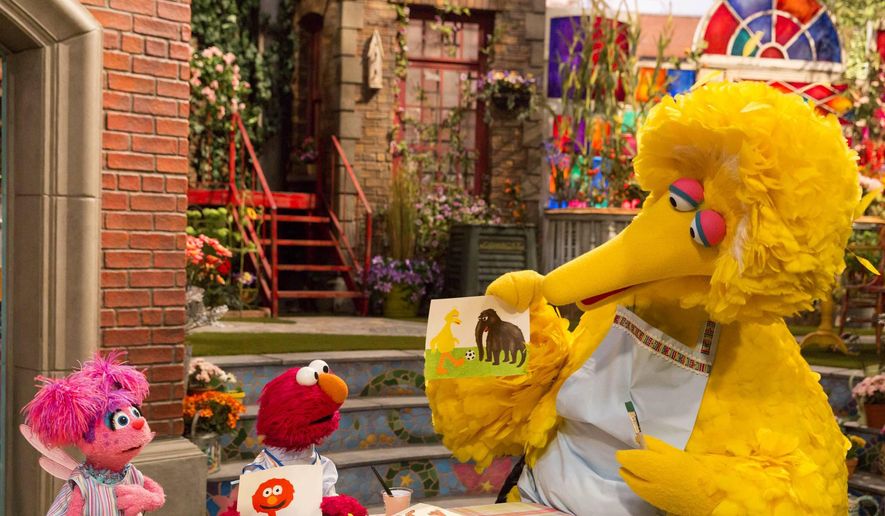 This image released by HBO shows characters, from left, Abby Cadabby, Elmo and Big Bird in a scene from &quot;Sesame Street.&quot; The popular children's TV show is celebrating its 50th season. (HBO via AP)