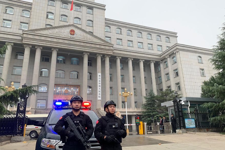 Police stand guard outside the Xingtai Intermediate People’s court in Xingtai, China Thursday, Nov. 7, 2019. A Chinese court sentenced three fentanyl traffickers Thursday in a case that was a culmination of a rare collaboration between Chinese and U.S. law enforcement to crack down on global networks that manufacture and distribute lethal synthetic opioids. (AP Photo/Erika Kinetz)