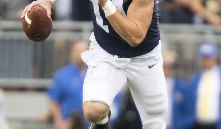 FILE - In this Sept. 14, 2019, file photo, Penn State quarterback Sean Clifford (14) scrambles during an NCAA college football game against Pittsburgh, in State College, Pa. Penn State (8-0) plays against Minnesota (8-0) on Saturday, Nov. 9. (AP Photo/Barry Reeger, File)