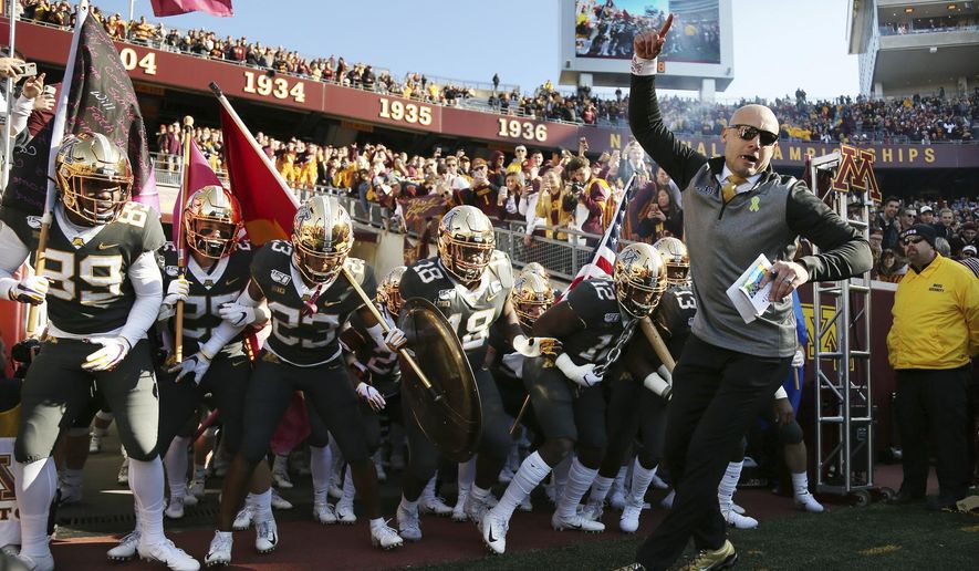 FILE - In this Oct. 26, 2019, file photo, Minnesota head coach P.J. Fleck leads him team on the field prior to an NCAA college football game against Maryland, in Minneapolis. Penn State (8-0) plays against Minnesota (8-0) on Saturday, Nov. 9. (AP Photo/Stacy Bengs, File)