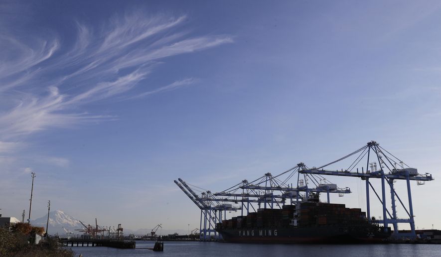 In this Monday, Nov. 4, 2019, photo with Mount Rainier in the background, cranes and a cargo container ship are shown at the Port of Tacoma in Tacoma, Wash. On Wednesday, Nov. 6, the Labor Department issues revised data on productivity in the second quarter. (AP Photo/Ted S. Warren)
