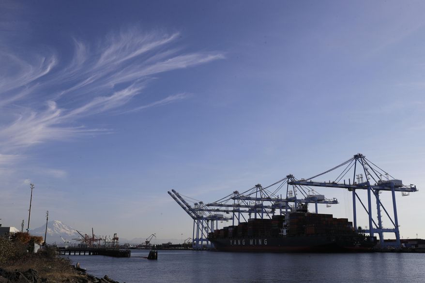 In this Monday, Nov. 4, 2019, photo with Mount Rainier in the background, cranes and a cargo container ship are shown at the Port of Tacoma in Tacoma, Wash. On Wednesday, Nov. 6, the Labor Department issues revised data on productivity in the second quarter. (AP Photo/Ted S. Warren)