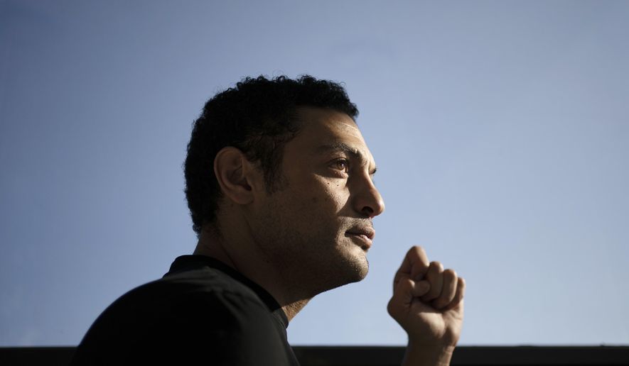 Self-exiled contractor Mohamed Ali, from Egypt, poses for a photo at an office in Spain, Tuesday, Nov. 5, 2019. Ali pitches himself as a former government insider. Without offering evidence, he says he’s witnessed high-level corruption and large-scale misuse of funds as a construction contractor for the military. (AP Photo/Felipe Dana)
