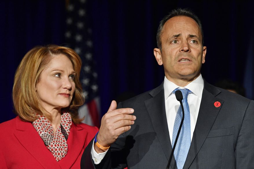 Kentucky Gov. Matt Bevin, right, with his wife Glenna, speaks to supporters gathered at the republican party celebration event in Louisville, Ky., Tuesday, Nov. 5, 2019. (AP Photo/Timothy D. Easley)