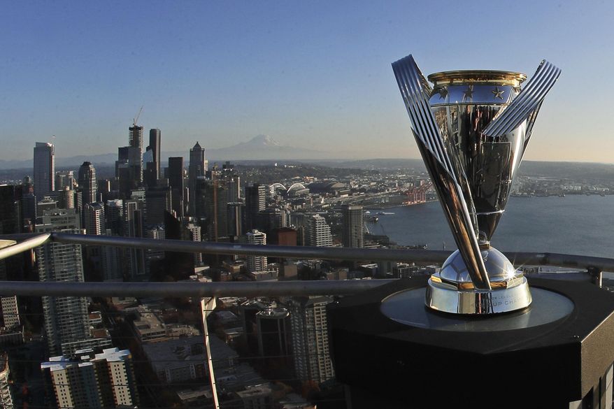 The MLS Cup trophy is displayed on the roof of the Space Needle, Tuesday, Nov. 5, 2019, in Seattle. The Seattle Sounders are scheduled to face Toronto FC on Sunday in the MLS Cup soccer match at CenturyLink Field in Seattle, the third time the two teams have met for the MLS championship. (AP Photo/Ted S. Warren)