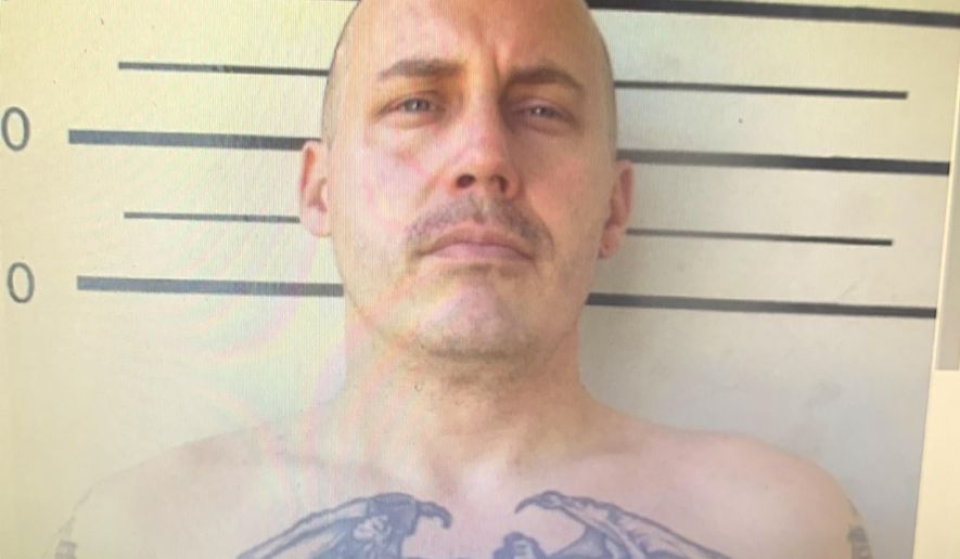 In this undated image made from a digital screen released by Thailand's Department of Corrections, shows a police custody photo of American citizen Bart Allen Helmus, 40 years old, after being arrested on drug charges. Helmus was among three prisoners who staged a violent escape from a courthouse in Thailand has shot and injured himself and his wife as police surrounded them Wednesday, Nov. 6, 2019. (Thailand Department of Corrections via AP)