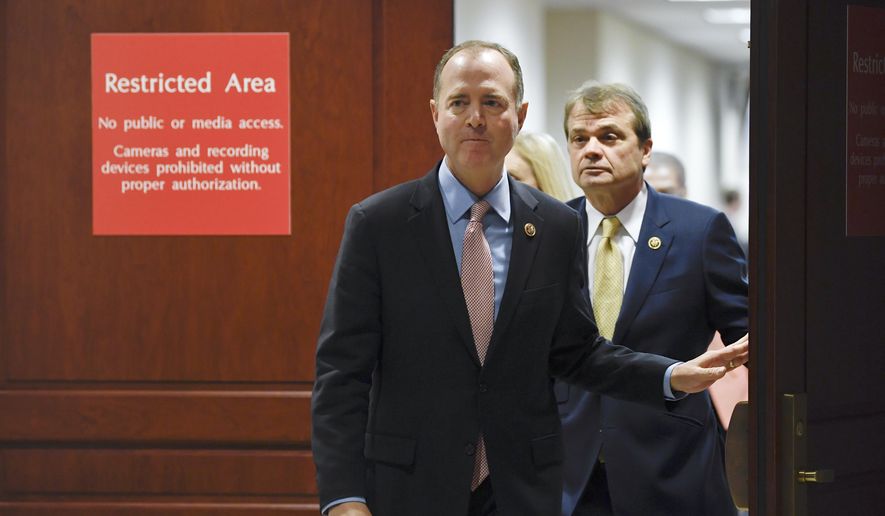 House Intelligence Committee Chairman Adam Schiff, D-Calif., followed by Rep. Mike Quigley, D-Ill., walks out to talk to reporters on Capitol Hill in Washington, Wednesday, Nov. 6, 2019, about the House impeachment inquiry. (AP Photo/Susan Walsh) ** FILE **