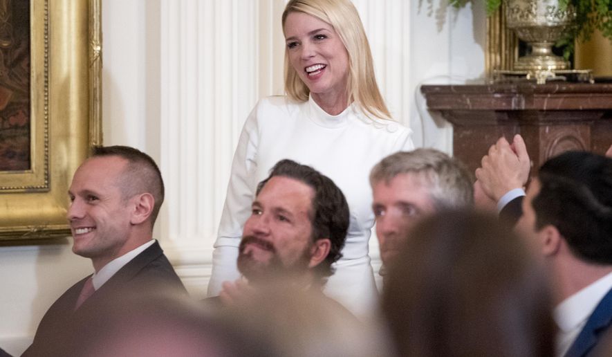 In this April 1, 2019, photo, former Florida attorney general Pam Bondi is recognized by President Donald Trump at the 2019 Prison Reform Summit and First Step Act Celebration in the East Room of the White House in Washington. The White House is beefing up its communications staff as it tries to grapple with the ongoing House impeachment investigation. A senior administration official tells The Associated Press that Bondi, and Tony Sayegh, a former Treasury Department spokesman, are expected to join the White House communications team to work on “proactive impeachment messaging” and other special projects. (AP Photo/Andrew Harnik, file)
