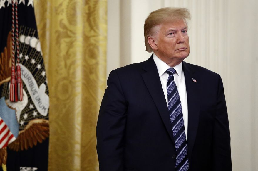 President Donald Trump listens during a ceremony to present the Presidential Citizens Medal posthumously to Rick Rescorla in the East Room of the White House, Thursday, Nov. 7, 2019, in Washington. (AP Photo/Patrick Semansky)