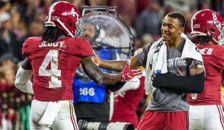 Alabama wide receiver Jerry Jeudy (4) gets congratulations from Alabama wide receiver DeVonta Smith during the second half of an NCAA college football game, Saturday, Oct. 26, 2019, in Tuscaloosa, Ala. (AP Photo/Vasha Hunt)