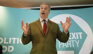 Brexit Party leader Nigel Farage gestures as he delivers a speech to supporters, during an event at the Washington Central Hotel, in Workington, England, Wednesday, Nov. 6, 2019. Britain goes to the polls on Dec. 12. (Danny Lawson/PA via AP)