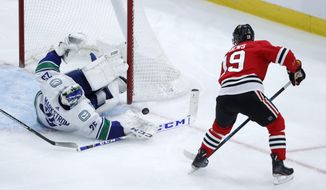 Vancouver Canucks goaltender Jacob Markstrom makes a save on a shot by Chicago Blackhawks&#x27; Jonathan Toews during the second period of an NHL hockey game Thursday, Nov. 7, 2019, in Chicago. (AP Photo/Charles Rex Arbogast)