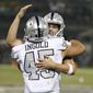 Oakland Raiders running back Alec Ingold (45) celebrates with quarterback Derek Carr after they connected on a touchdown pass against the Los Angeles Chargers during the first half of an NFL football game in Oakland, Calif., Thursday, Nov. 7, 2019. (AP Photo/D. Ross Cameron)