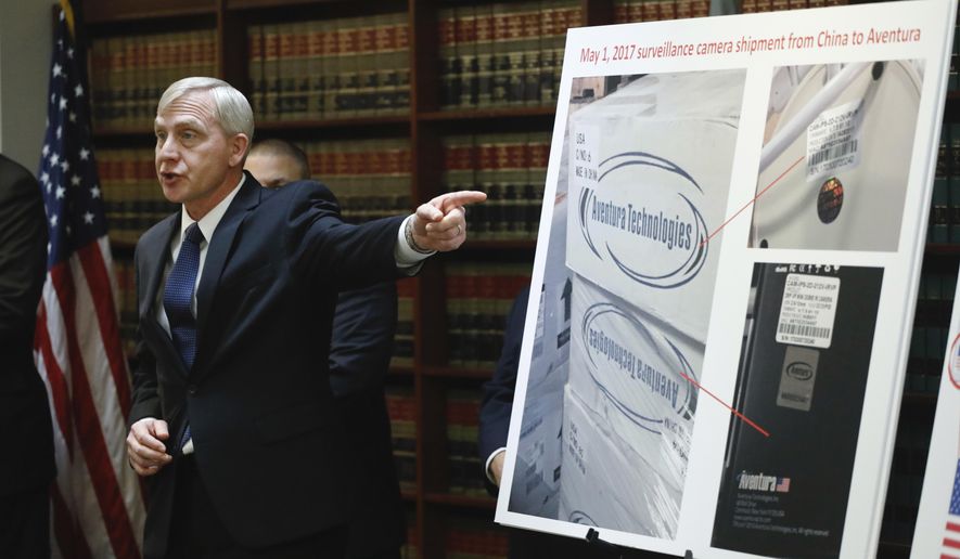 U.S. Attorney Richard P. Donoghue announces charges against Aventura Technologies, Thursday, Nov. 7, 2019, in the Brooklyn borough of New York. The New York company has been charged with illegally importing and selling Chinese-made surveillance and security equipment to U.S. government agencies and private customers. (AP Photo/Mark Lennihan)