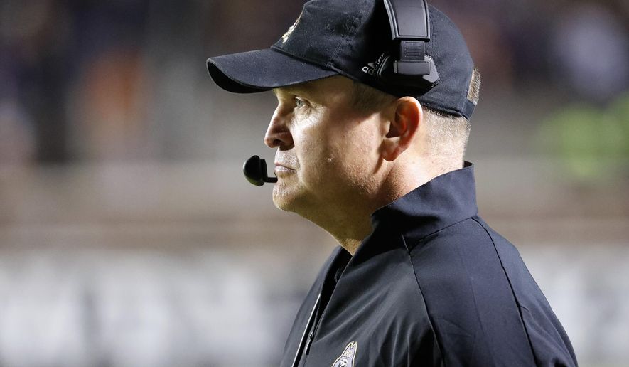 East Carolina head coach Mike Houston watches from the sideline during the first half of an NCAA college football game against Cincinnati in Greenville, N.C., Saturday, Nov. 2, 2019. (AP Photo/Karl B DeBlaker)