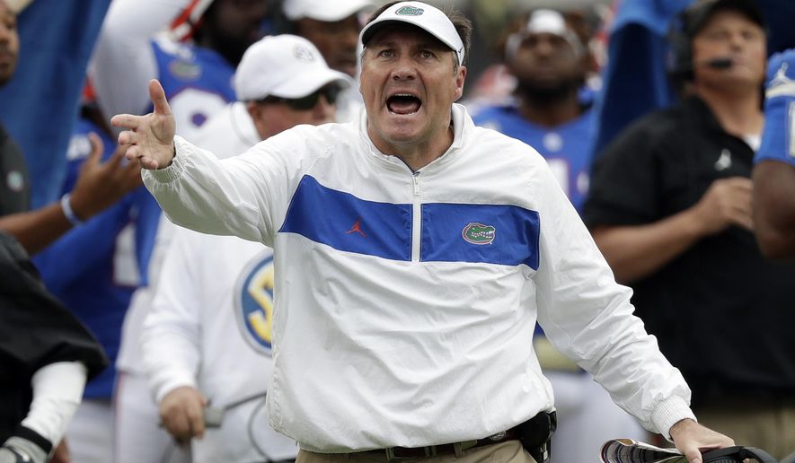 Florida head coach Dan Mullen disputes a call by officials during the first half of an NCAA college football game against Georgia, Saturday, Nov. 2, 2019, in Jacksonville, Fla. (AP Photo/John Raoux)