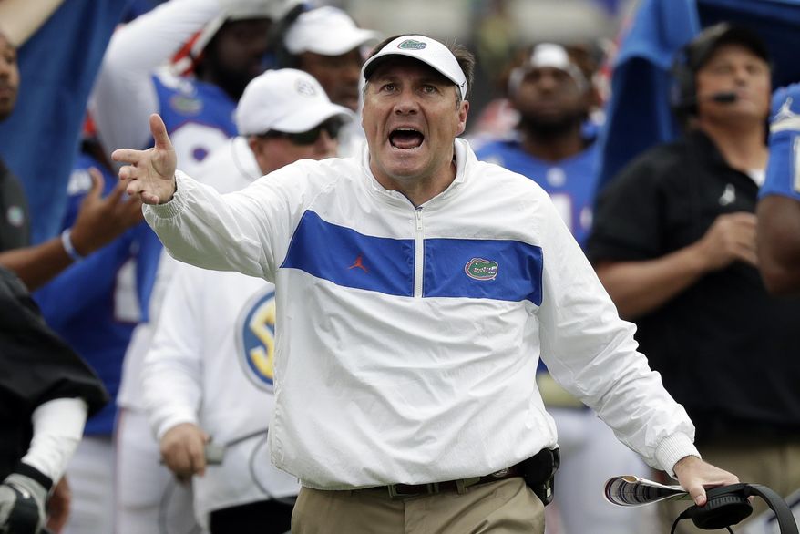 Florida head coach Dan Mullen disputes a call by officials during the first half of an NCAA college football game against Georgia, Saturday, Nov. 2, 2019, in Jacksonville, Fla. (AP Photo/John Raoux)