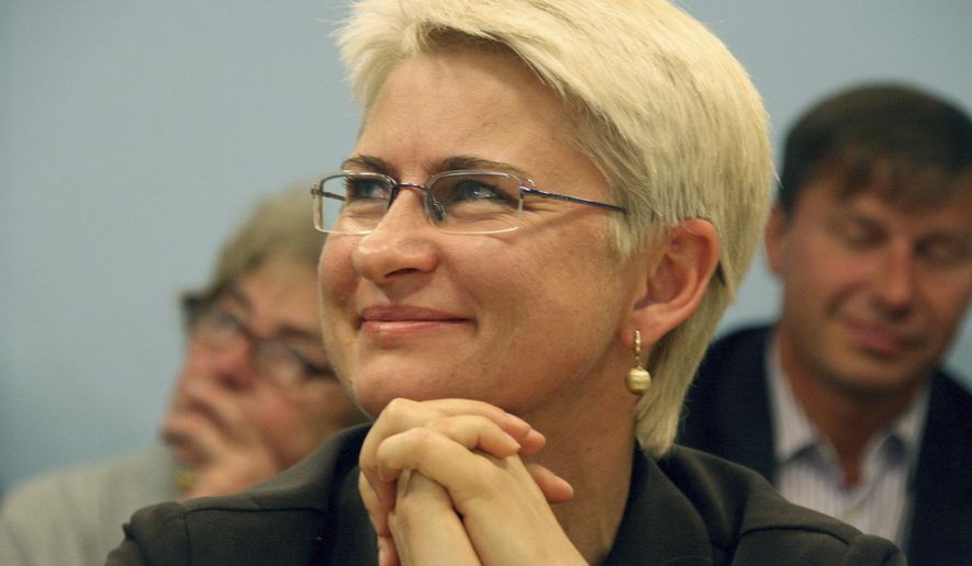 FILE - This 2012 photo provided by Juozas Valiusaitis shows Neringa Venckiene in Lithuania. A family member says the U.S. extradition appears to be underway for Venckiene, a former Lithuanian judge who faces charges in her homeland tied to her claims a ring of pedophiles victimized her 4-year-old niece. Her son tells The Associated Press that his mother messaged him Tuesday, Nov. 5, 2019, to say jail guards in Chicago ordered her to gather her belongings and that she was being taken away. The son, Karolis Venckus, said that could only mean the extradition process has begun. (photo courtesy Juozas Valiusaitis via AP File)