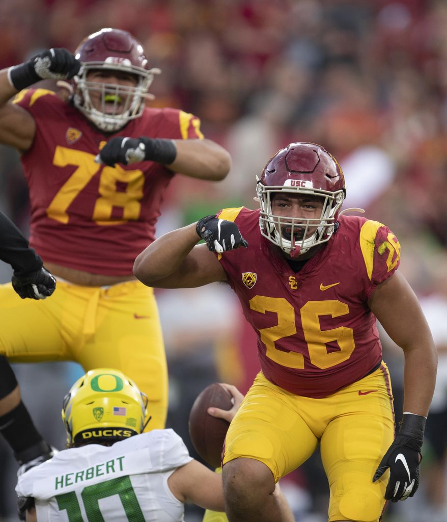 Southern California linebacker Kana'i Mauga, right, celebrates his sack against Oregon during the first half of an NCAA college football game Saturday, Nov. 2, 2019, in Los Angeles. (AP Photo/Kyusung Gong)