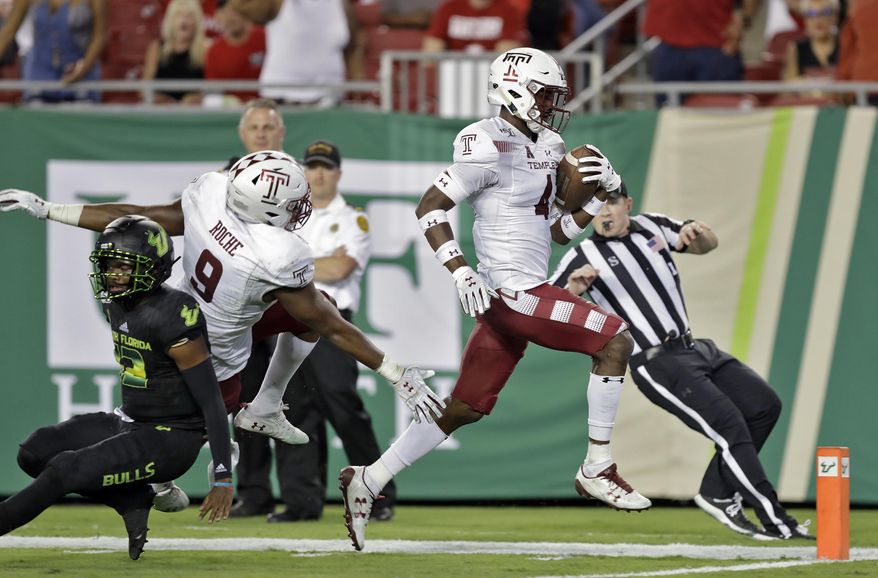 Temple linebacker Sam Franklin (4) runs a South Florida fumble back for a touchdown during the second half of an NCAA college football game Thursday, Nov. 7, 2019, in Tampa, Fla. (AP Photo/Chris O'Meara)