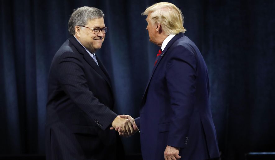 In this file photo, President Donald Trump shakes hands with Attorney General William Barr before Trump signed an executive order creating a commission to study law enforcement and justice at the International Association of Chiefs of Police Convention Monday, Oct. 28, 2019, in Chicago. In a speech to the Federalist Society in Washington on Nov. 15, Mr. Barr blasted progressives for waging an ongoing campaign to thwart the Trump presidency from functioning, saying self-styled &quot;resistance&quot; progressives &quot;see themselves as engaged in a war to cripple, by any means necessary, a duly elected government.&quot; (AP Photo/Charles Rex Arbogast)