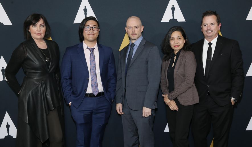 From left to right, Nicholl fellows Karen McDermott, Aaron Chung, Walker McKnight, Renee Pillai and Sean Malcolm pose at the Academy Nicholl Fellowships in Screenwriting Awards and Live Read at the Academy of Motion Picture Arts and Sciences Samuel Goldwyn Theater on Thursday, Nov. 7, 2019, in Beverly Hills, Calif. (Photo by Danny Moloshok/Invision/AP)