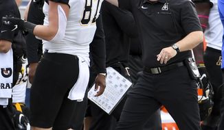 Appalachian State head coach Eliah Drinkwitz talks to Appalachian State tight end Collin Reed (87) during the first half of an NCAA college football game against South Alabama, Saturday, Oct. 26, 2019, at Ladd-Peebles Stadium in Mobile, Ala. (AP Photo/Julie Bennett)