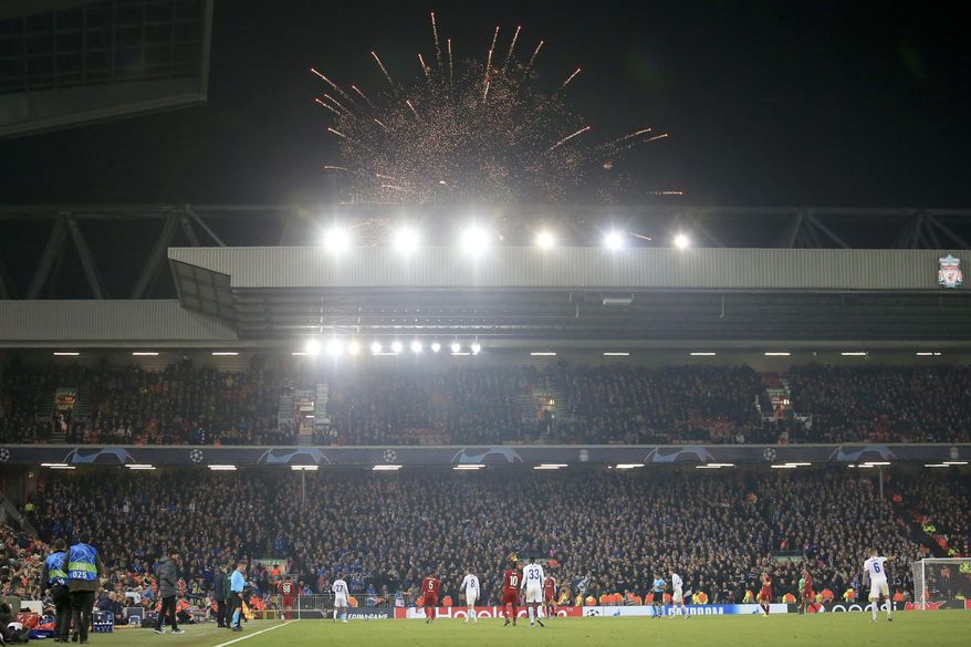 Guy Fawkes Night fireworks go off outside the stadium during the Champions League group E soccer match between Liverpool and Genk at Anfield Stadium, Liverpool, England, Tuesday, Nov. 5, 2019. (AP Photo/Jon Super)