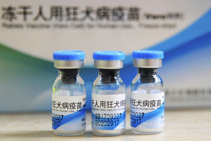 FILE - In this July 24, 2018, file photo, bottles of rabies vaccines made by Liaoning Chengda are seen at a Chinese Center for Disease Control and Prevention (CDC) station in Jiujiang in southern China's Jiangxi province. Changchun Changsheng Life Sciences Ltd., a Chinese maker of rabies vaccine, that was fined 9.1 billion yuan ($1.3 billion) in a product quality scandal that set off a crackdown on the industry said Friday, Nov. 8, 2019 it has been declared bankrupt. (Chinatopix via AP, File)