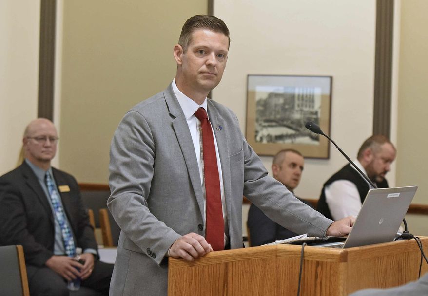 In this July 17, 2019 photo, North Dakota State Auditor Josh Gallion appears before the Legislative Audit and Fiscal Review Committee in the state capitol in Bismarck. Prosecutors have declined to pursue criminal charges against North Dakota State College of Science officials accused of withholding records from investigators. Gallion issued the report earlier this year that focused on management of the school's career workforce program. It alleged that Tony Grindberg, the school's vice president of workforce affairs and a former state lawmaker, failed to disclose his wife's company that was paid $39,500 to formulate a marketing plan for the program. (Tomm Stromme/The Bismarck Tribune via AP)
